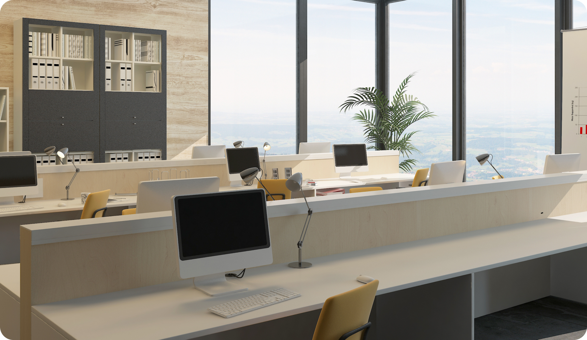 Modern office interior with desks, computers, and large windows overlooking the ocean.