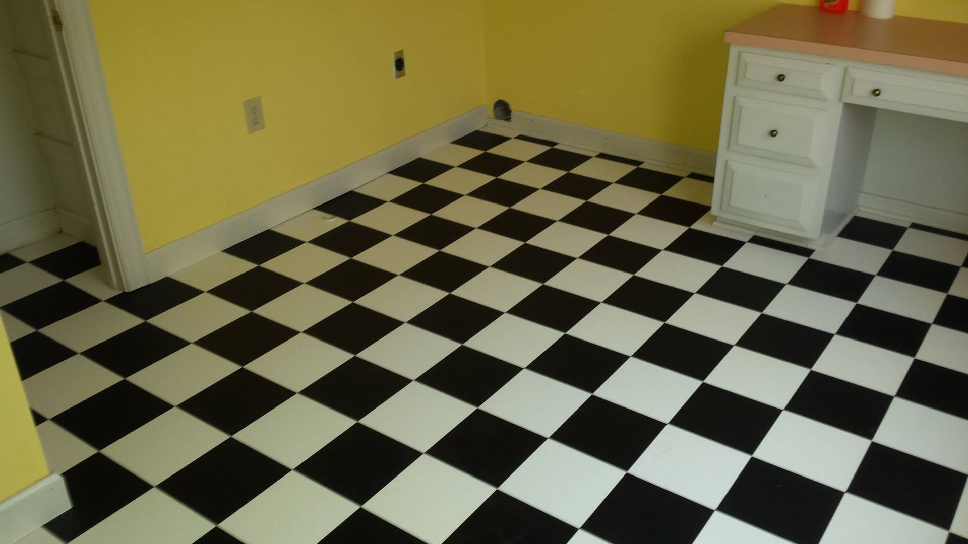 A black and white checkered floor in a room