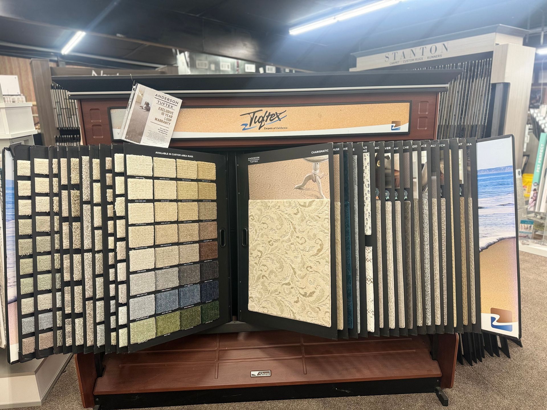 A display case with a lot of different types of tiles on it in a store.