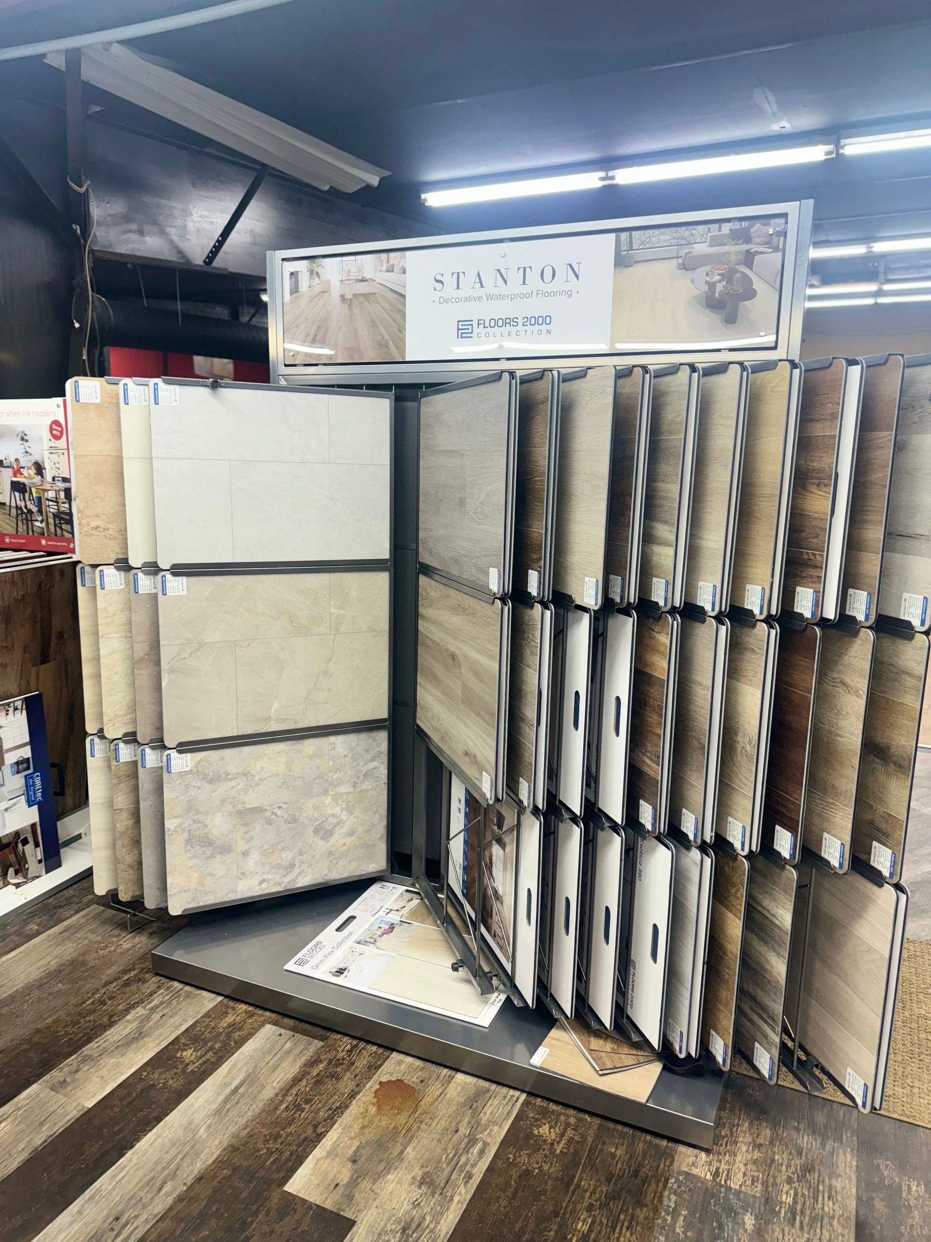 A display of tiles and carpets in a store.