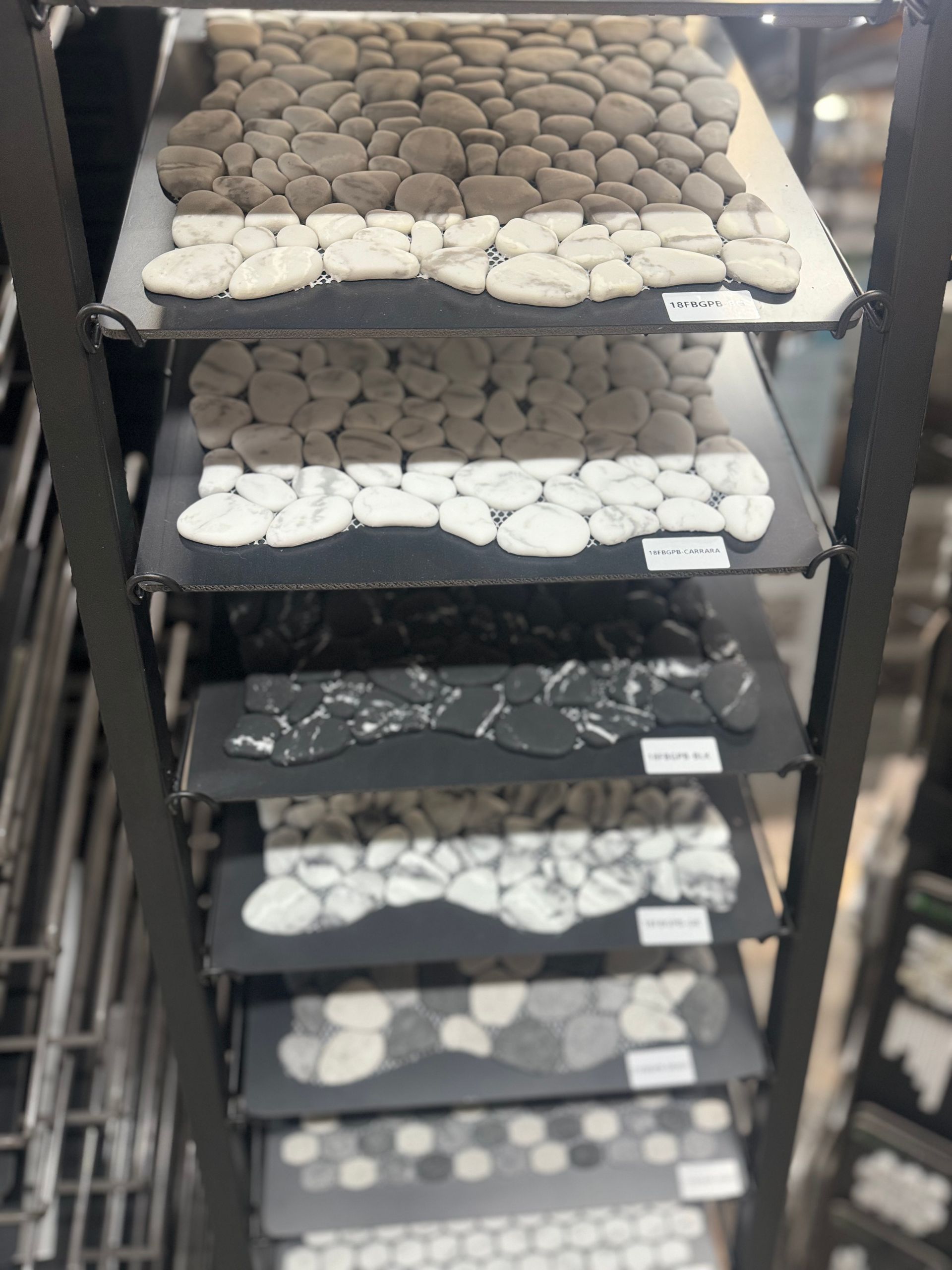 A display of different types of rocks on a shelf