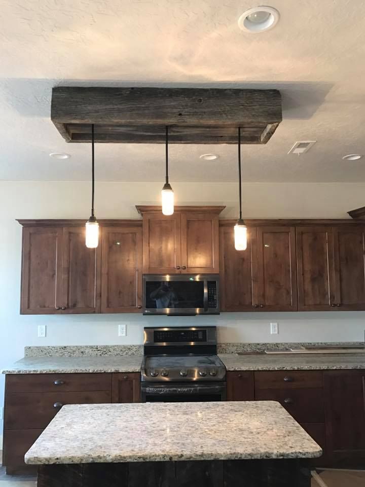 A kitchen with stainless steel appliances and granite counter tops