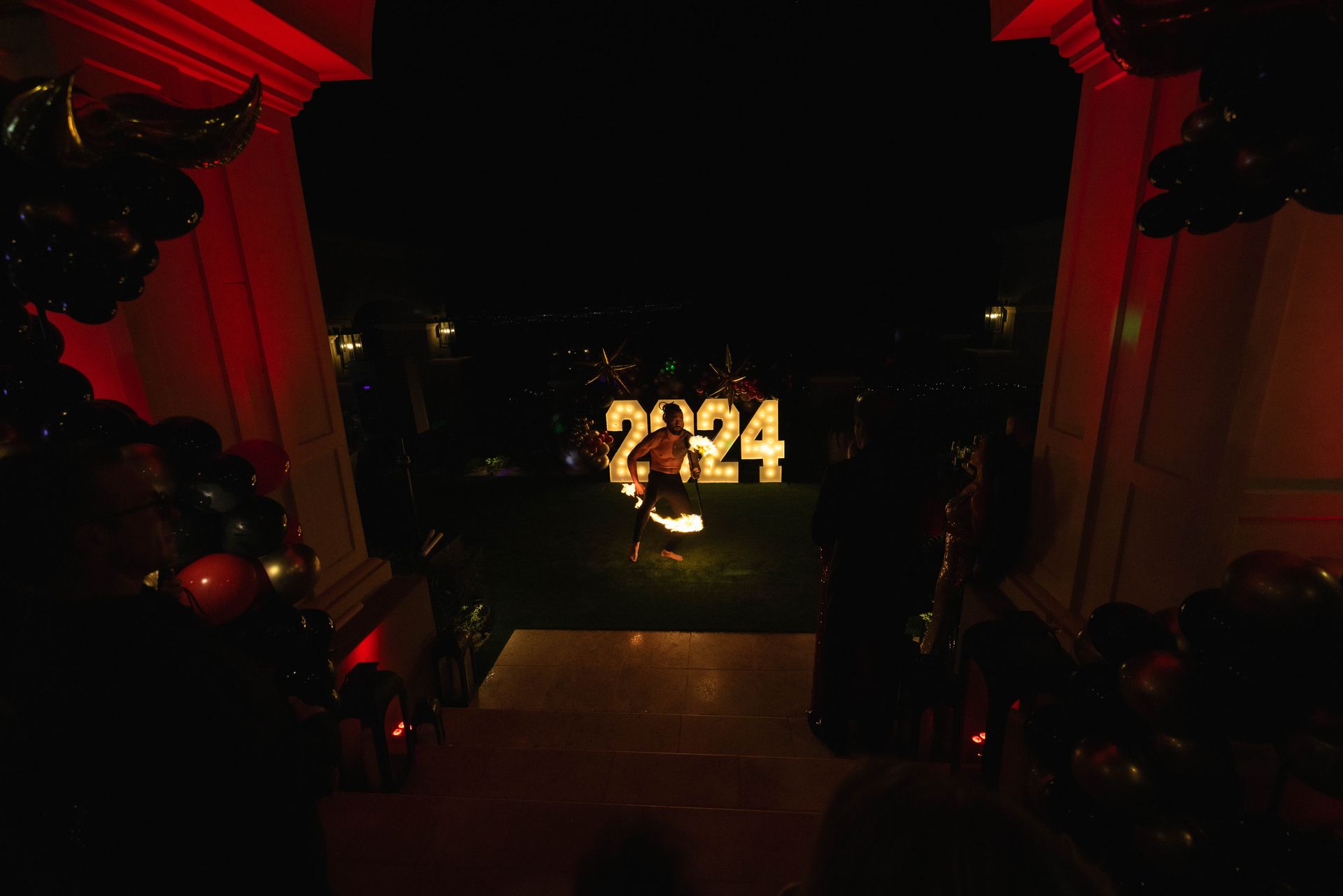 An aerial view of a new year 's eve party with balloons and lights.