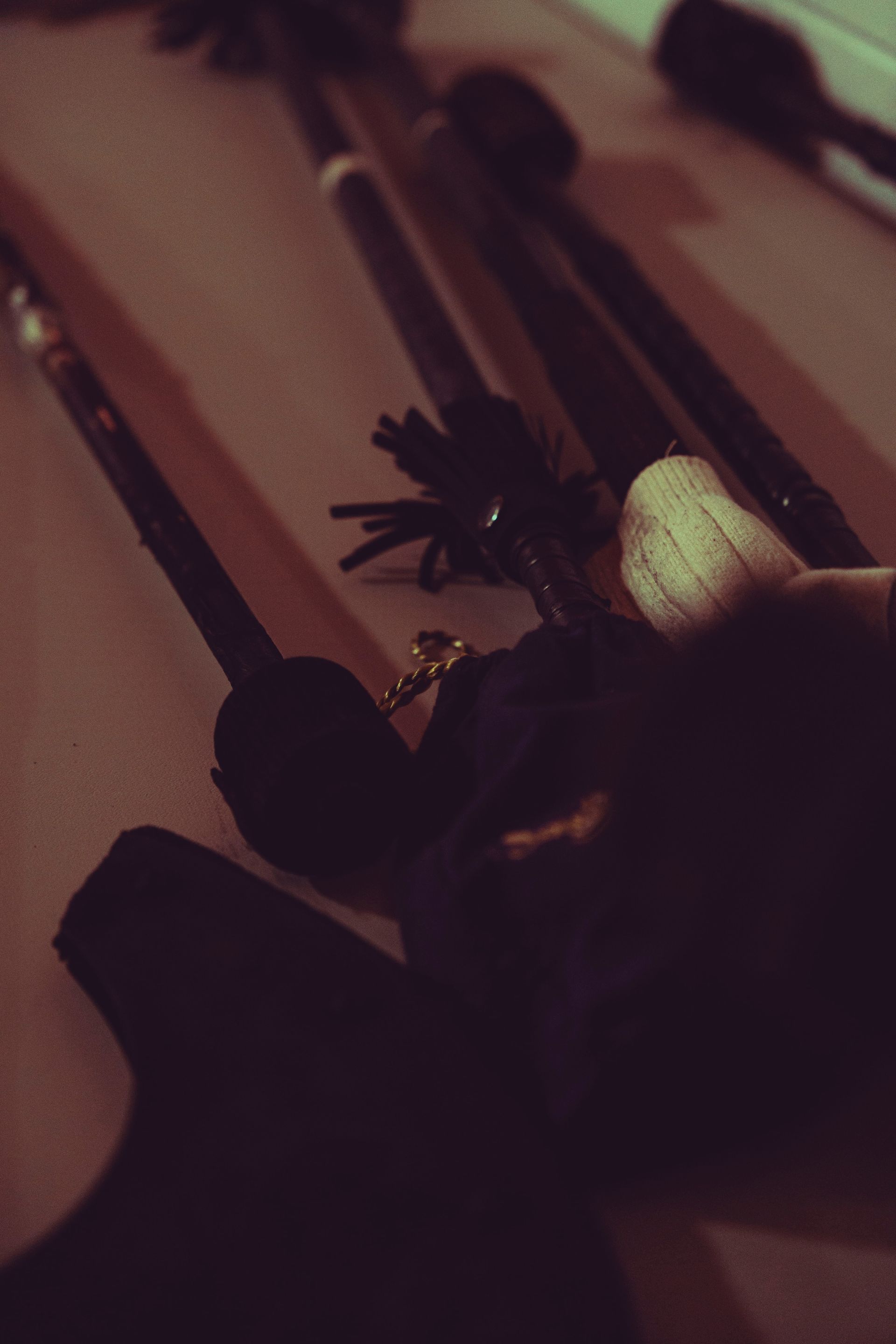 A person is holding a black object in their hand