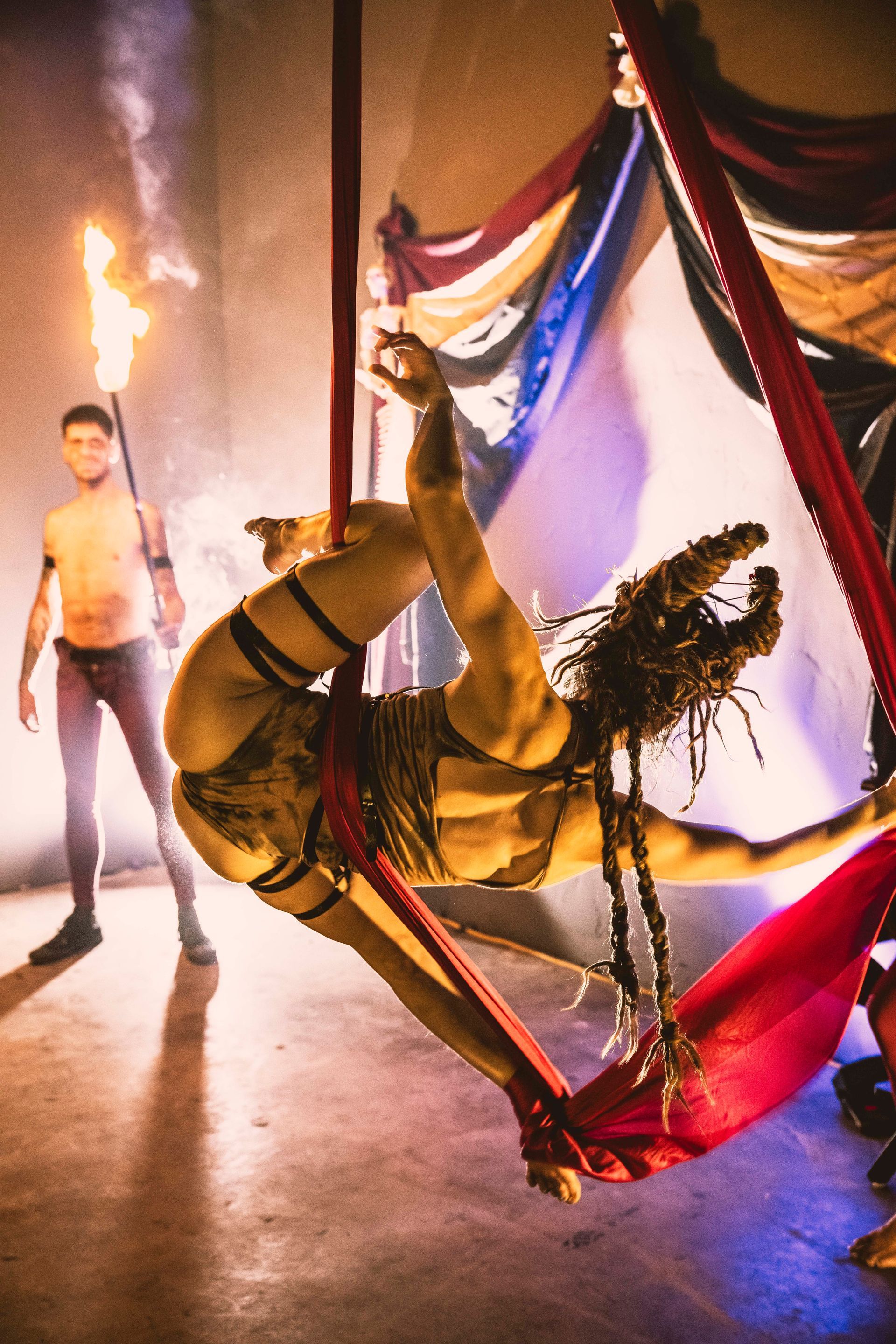 A woman performing aerial hammock.