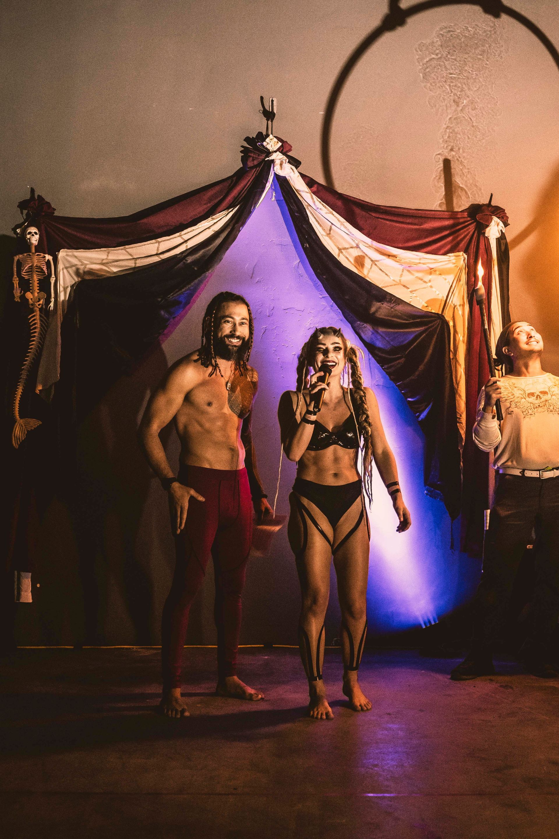 A man and a woman are standing next to each other in a room.