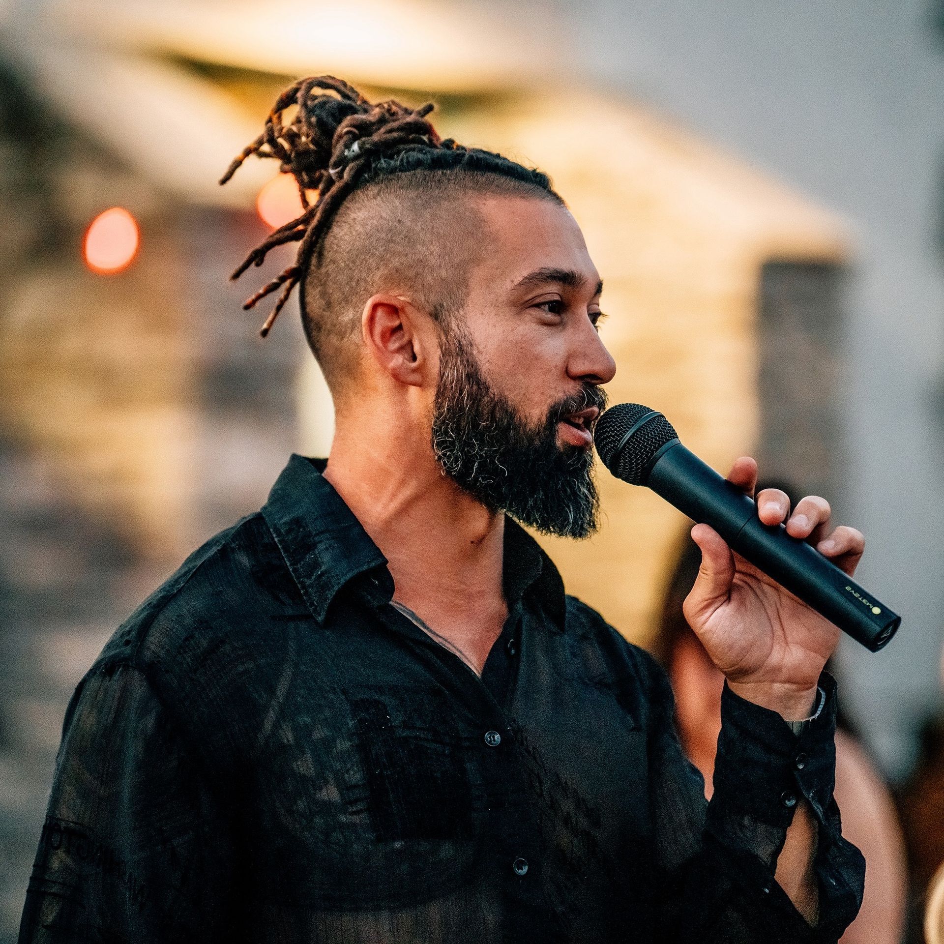Joseph Cancilla Speaking on a Microphone