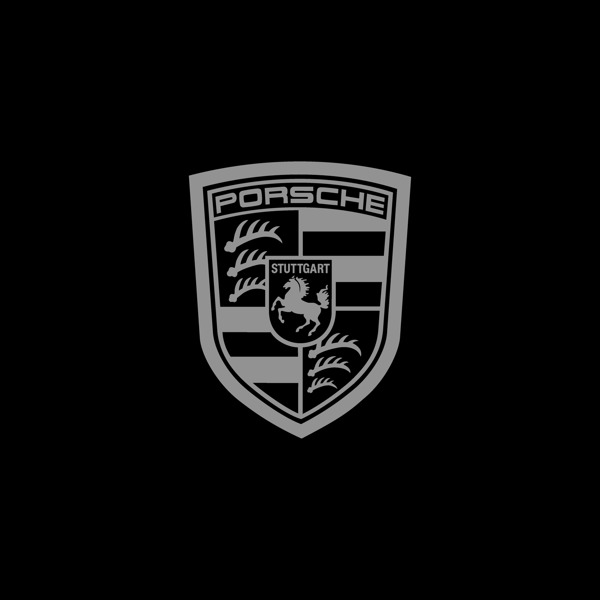 Gray Porsche emblem on a black background.