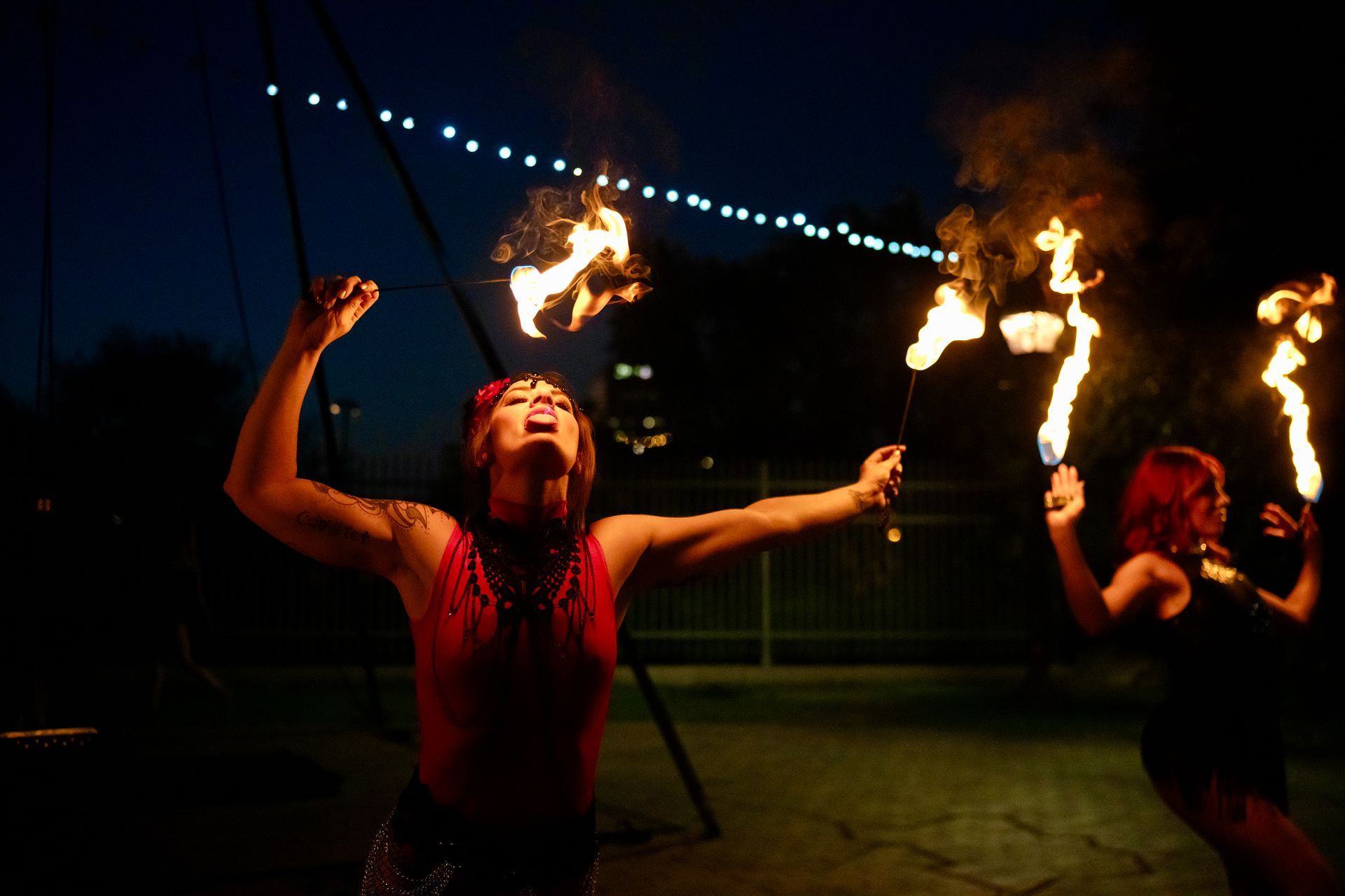 Female fire dancers performing in a show.