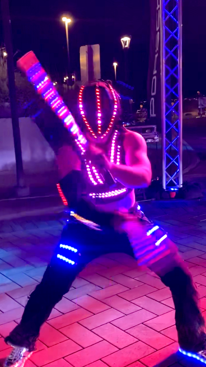 A man is holding a lighted stick in his hand