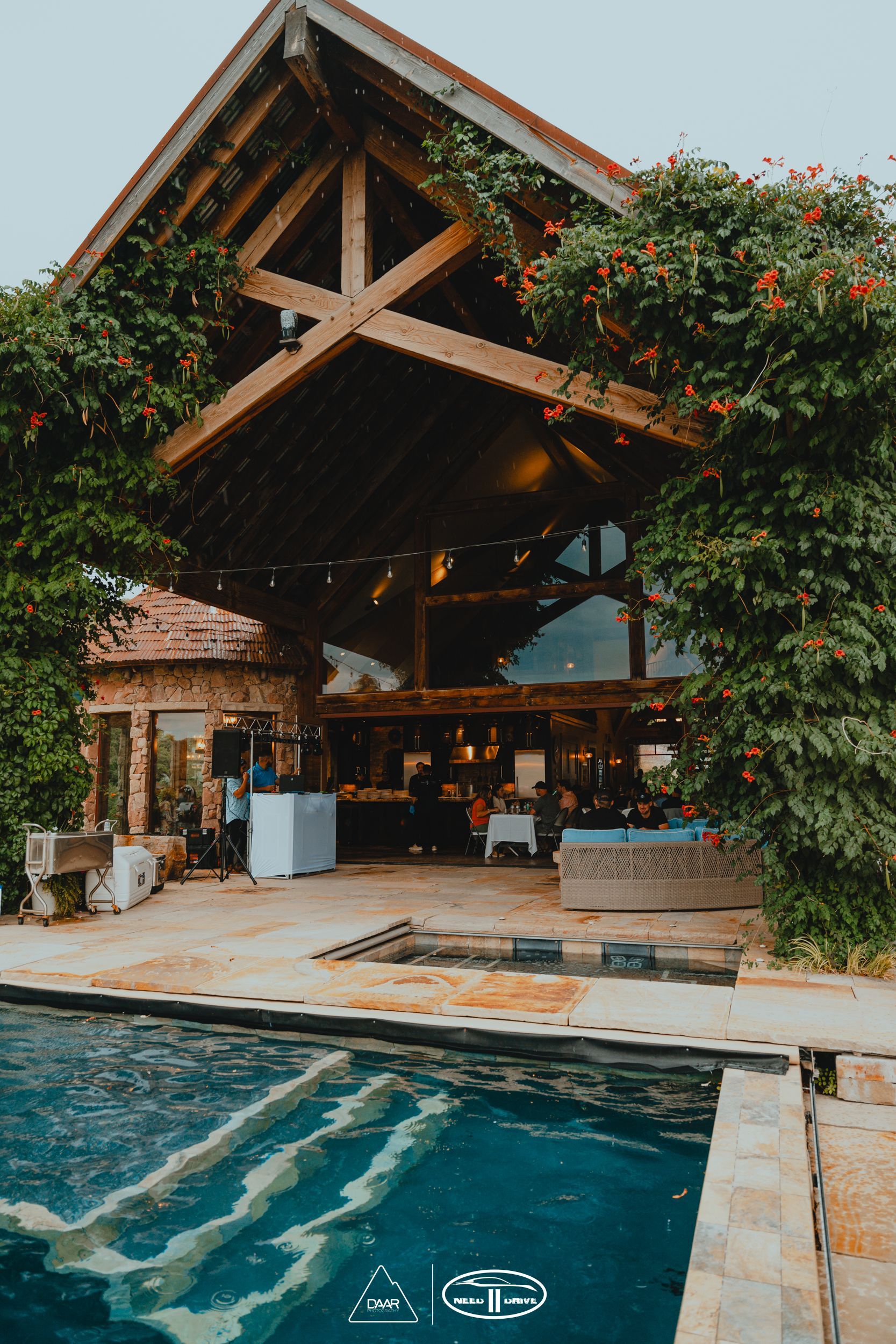 A large house with a swimming pool in front of it.
