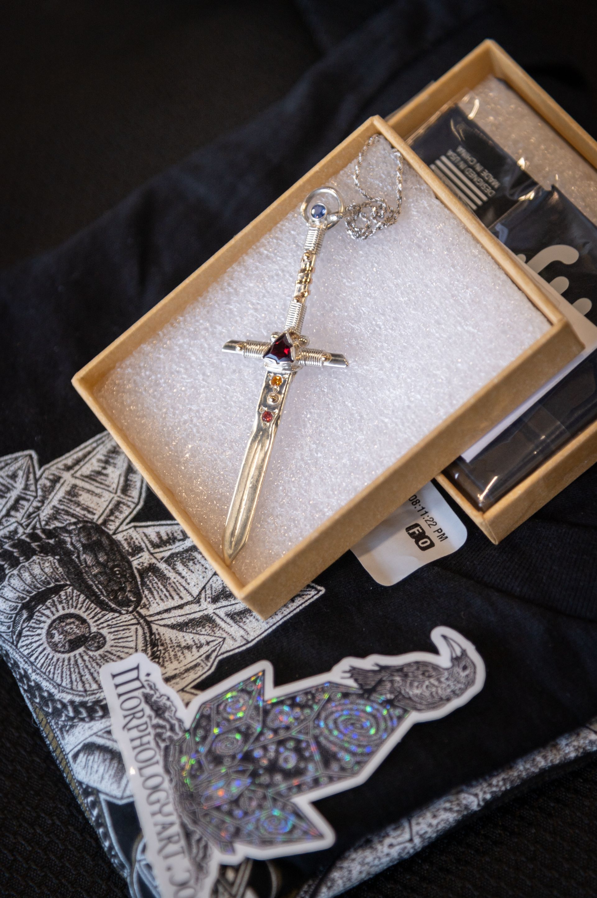 A box with a cross necklace in it