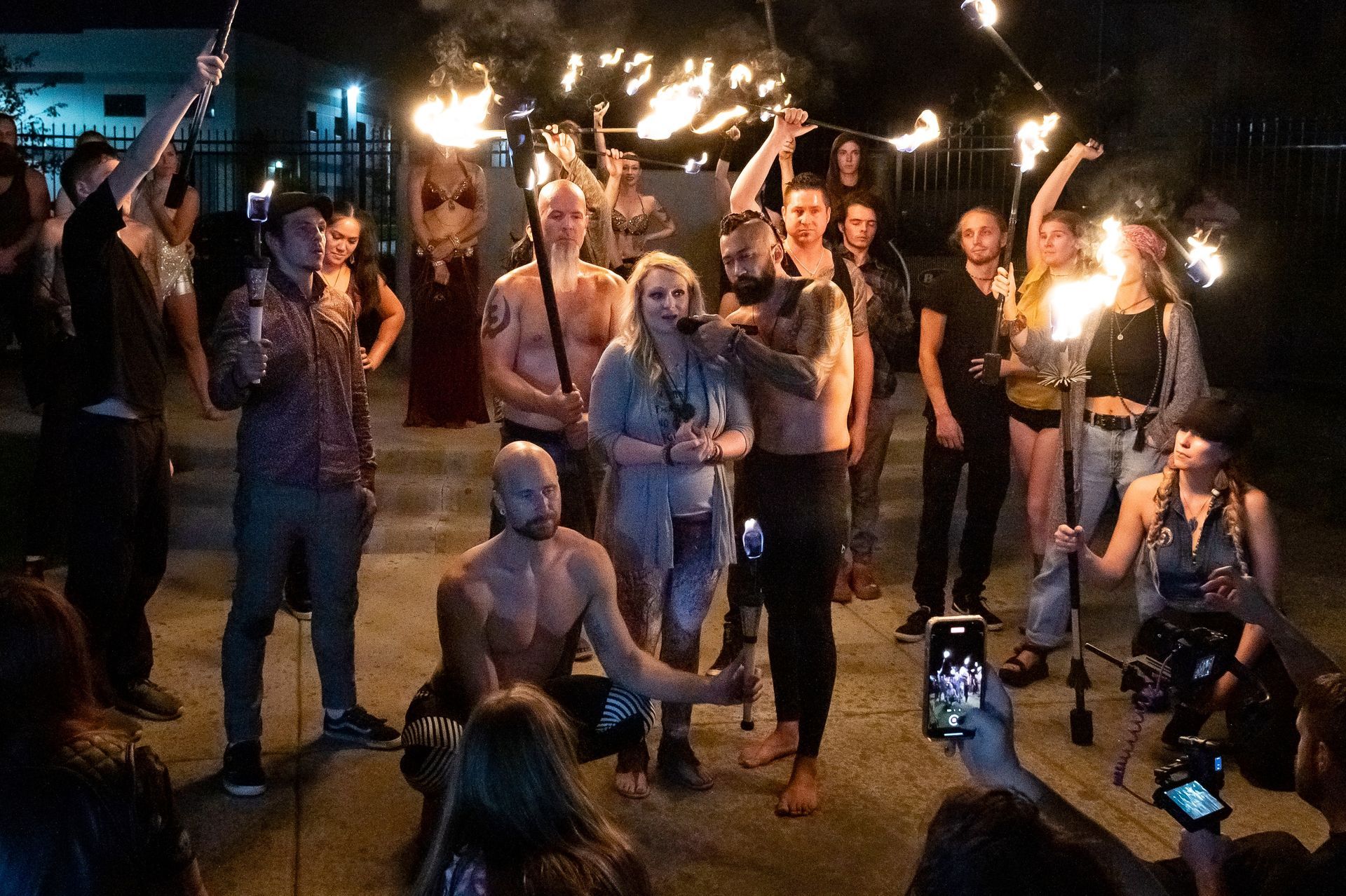 A group of people are holding fireworks in their hands