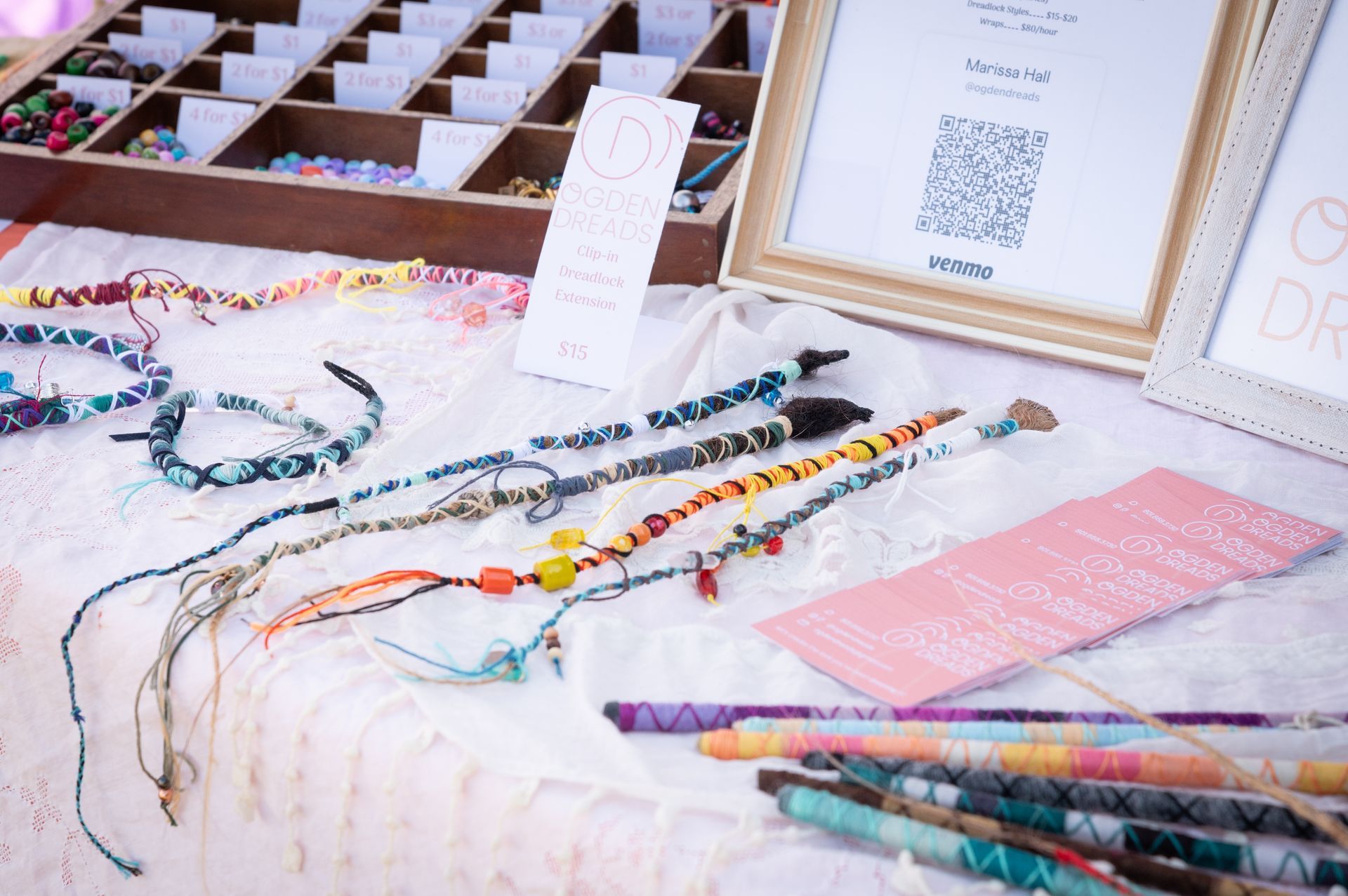 A table with a bunch of bracelets on it