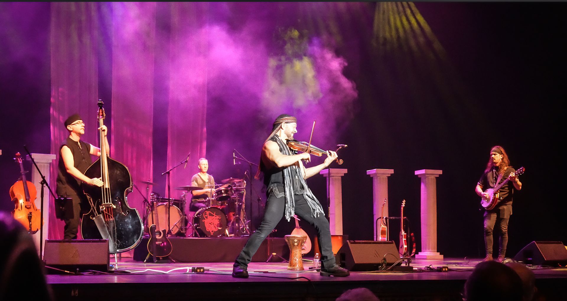 A person is cutting a piece of meat on a cutting board.
