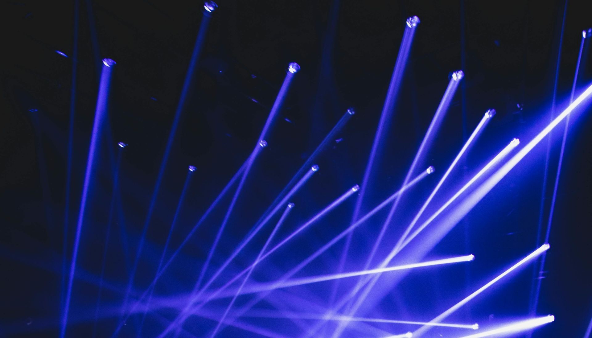 A bunch of blue lights are shining in the dark.