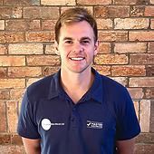 David Pearce in front of a brick wall