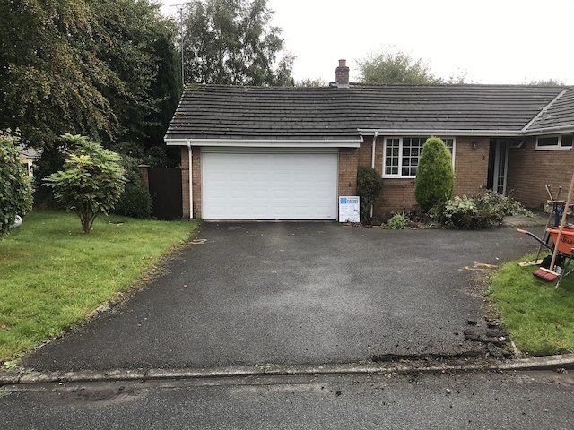 the previous worn tarmac driveway.