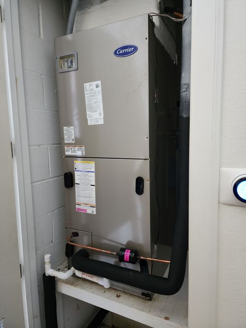 A carrier air conditioner is installed in a closet.