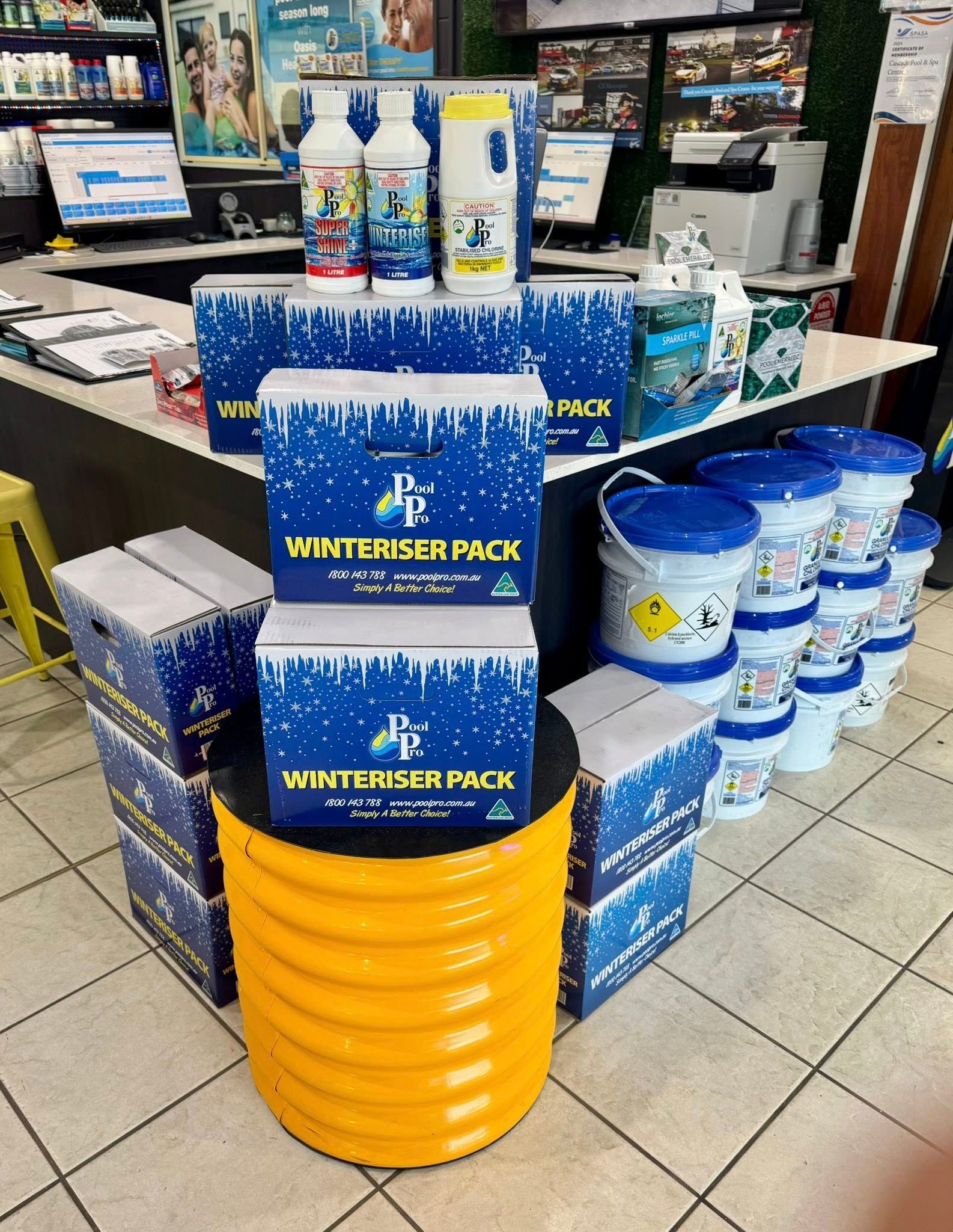 A Display of Pool Chemicals for Winterizing on a Yellow Barrel — Cascade Pool & Spa Centre in Macksville, NSW