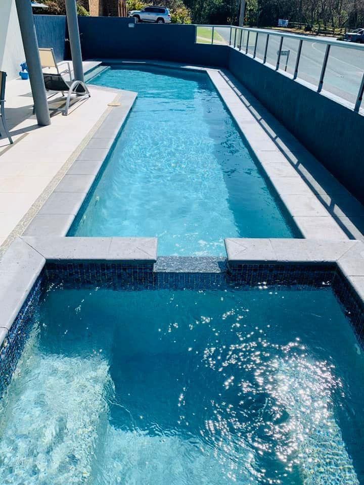 Narrow pool with blue water and white deck on a boat, viewed from the stern — Cascade Pool & Spa Centre in Port Macquarie, NSW