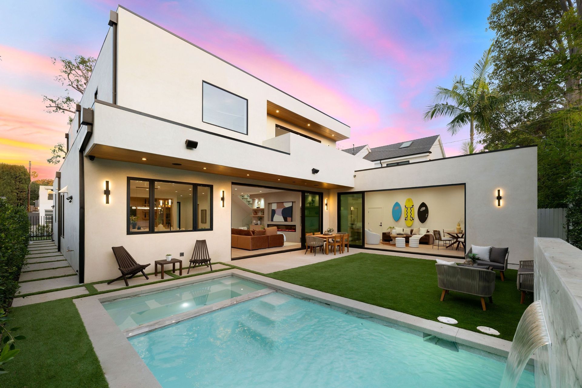 Pool in front of a stone building with blue shutters and trees under a clear sky — Cascade Pool & Spa Centre in Port Macquarie, NSW