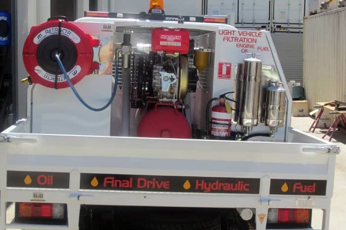 The back of a truck with the words final drive hydraulic and oil on it