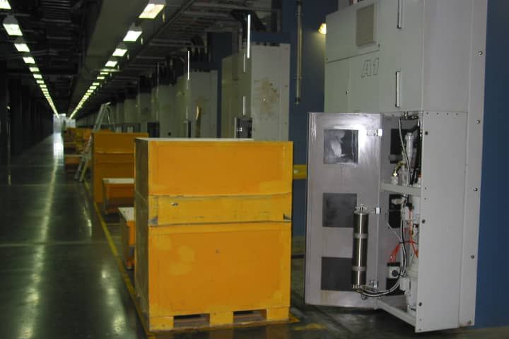 A warehouse with a lot of boxes and a machine