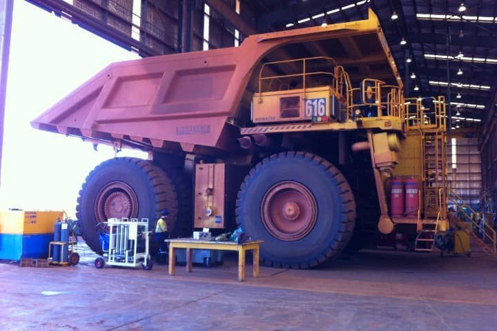 A large dump truck with the number 616 on it