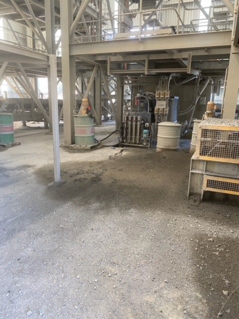 A large building with a lot of barrels in it