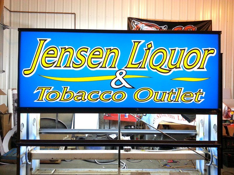 Metal Signs — Jensen Liquor (Sheldon, IA) in Harrisburg, SD