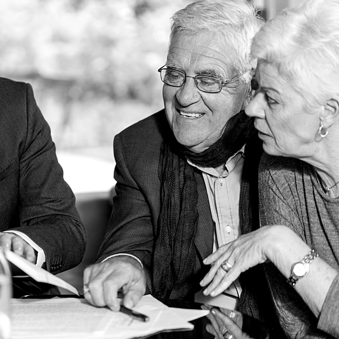 old couple looking at documents