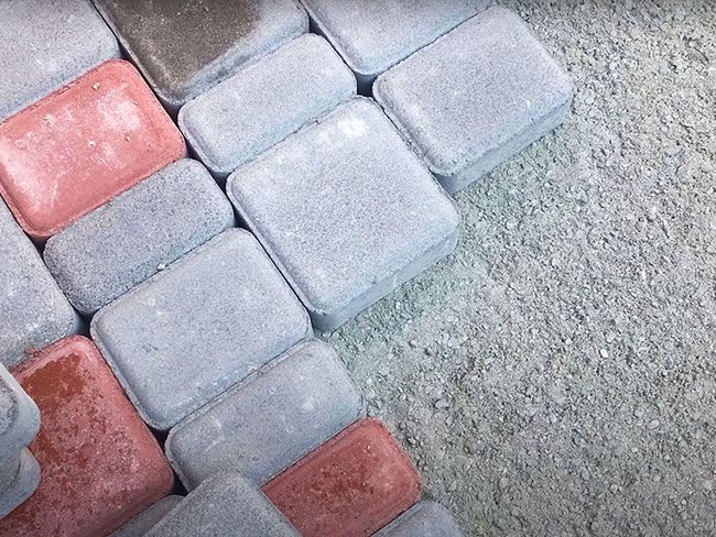 Paving stones arranged on a construction site during daylight hours