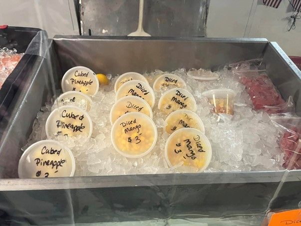 A tray of ice cubes filled with pineapple juice