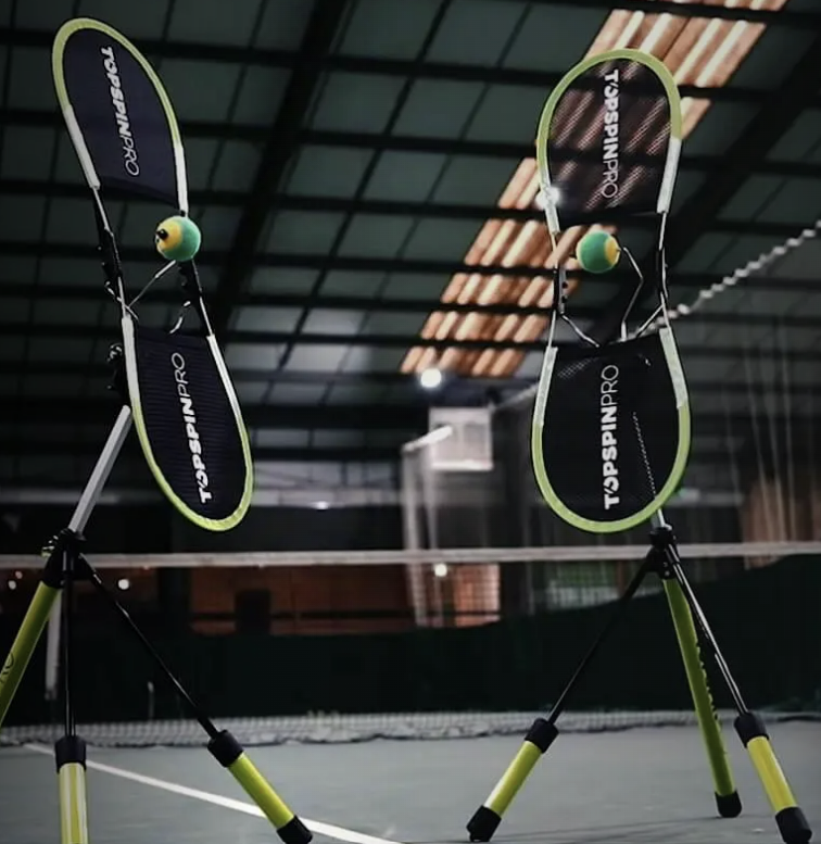 Two tennis rackets with the word toppingpro on them