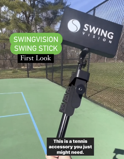 A person holding a swingvision swing stick on a tennis court