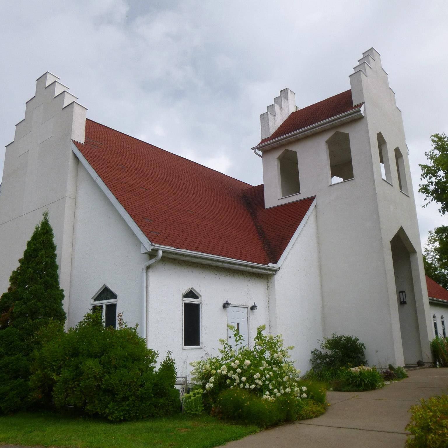 A large white church with a red roof