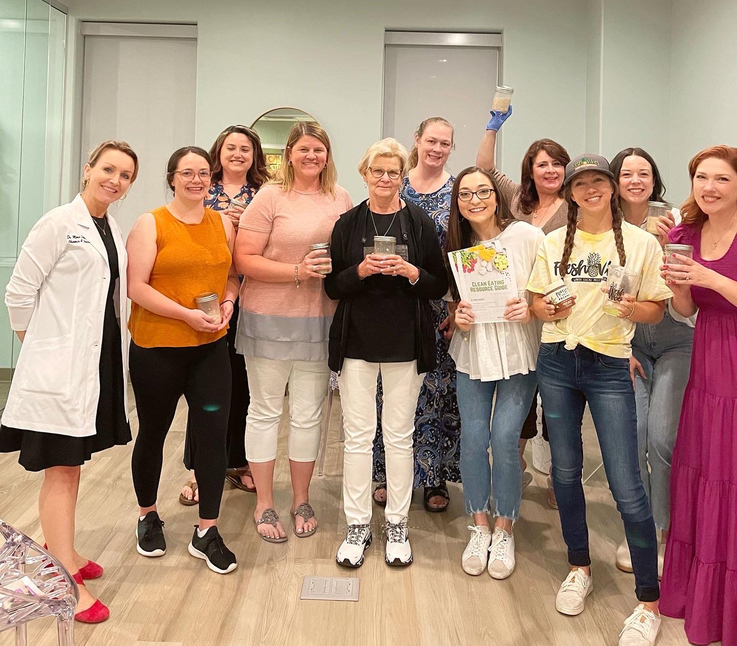 Noel standing with group during a nutrition night