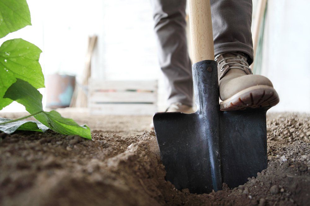 Person Digging With Shovel — Chattanooga, TN — Coddington Enterprise