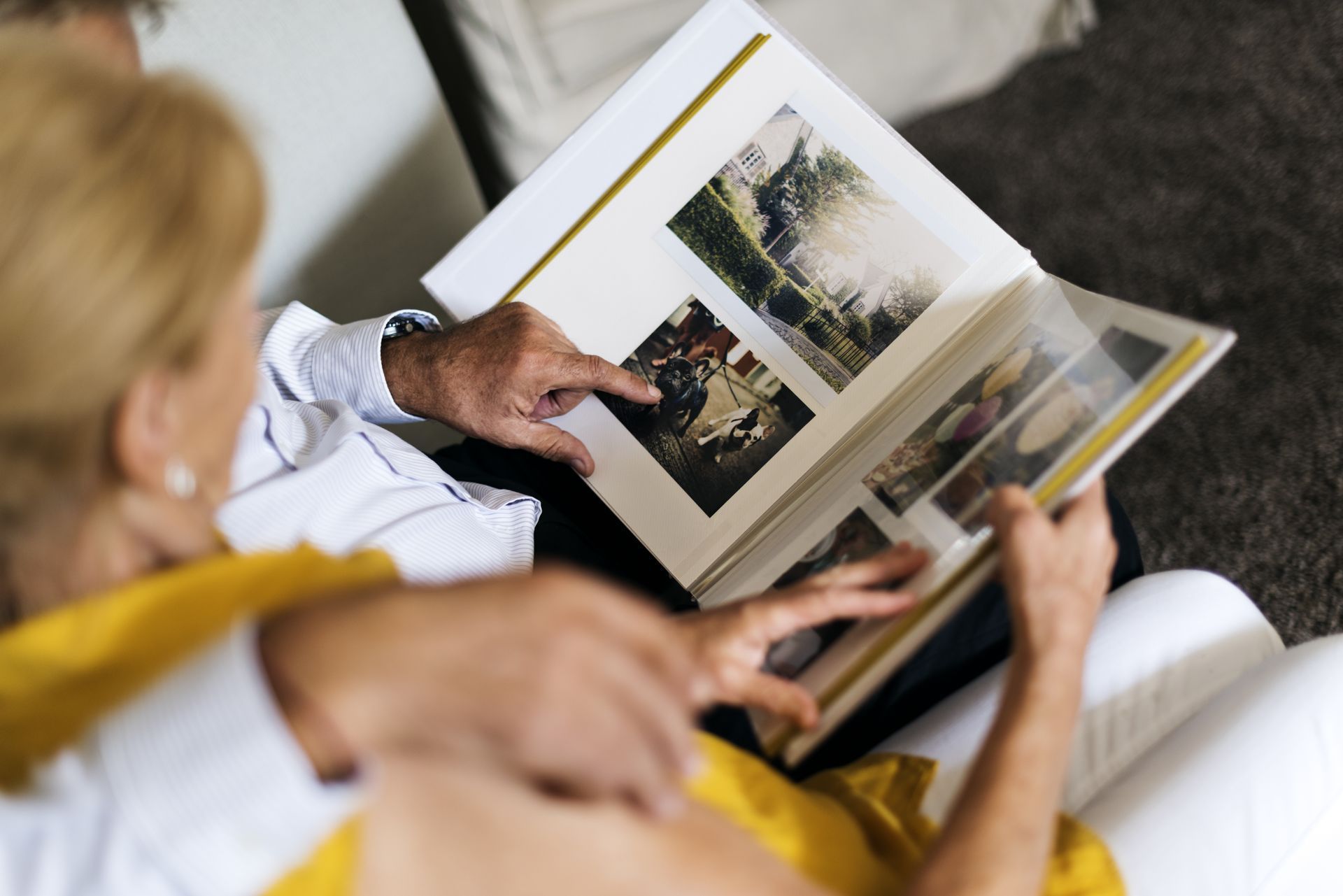 Two family photos: Group smiles indoors; a woman embraces her daughter outside.