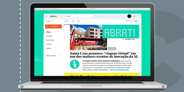 Um laptop está aberto em uma página com a imagem de um prédio.