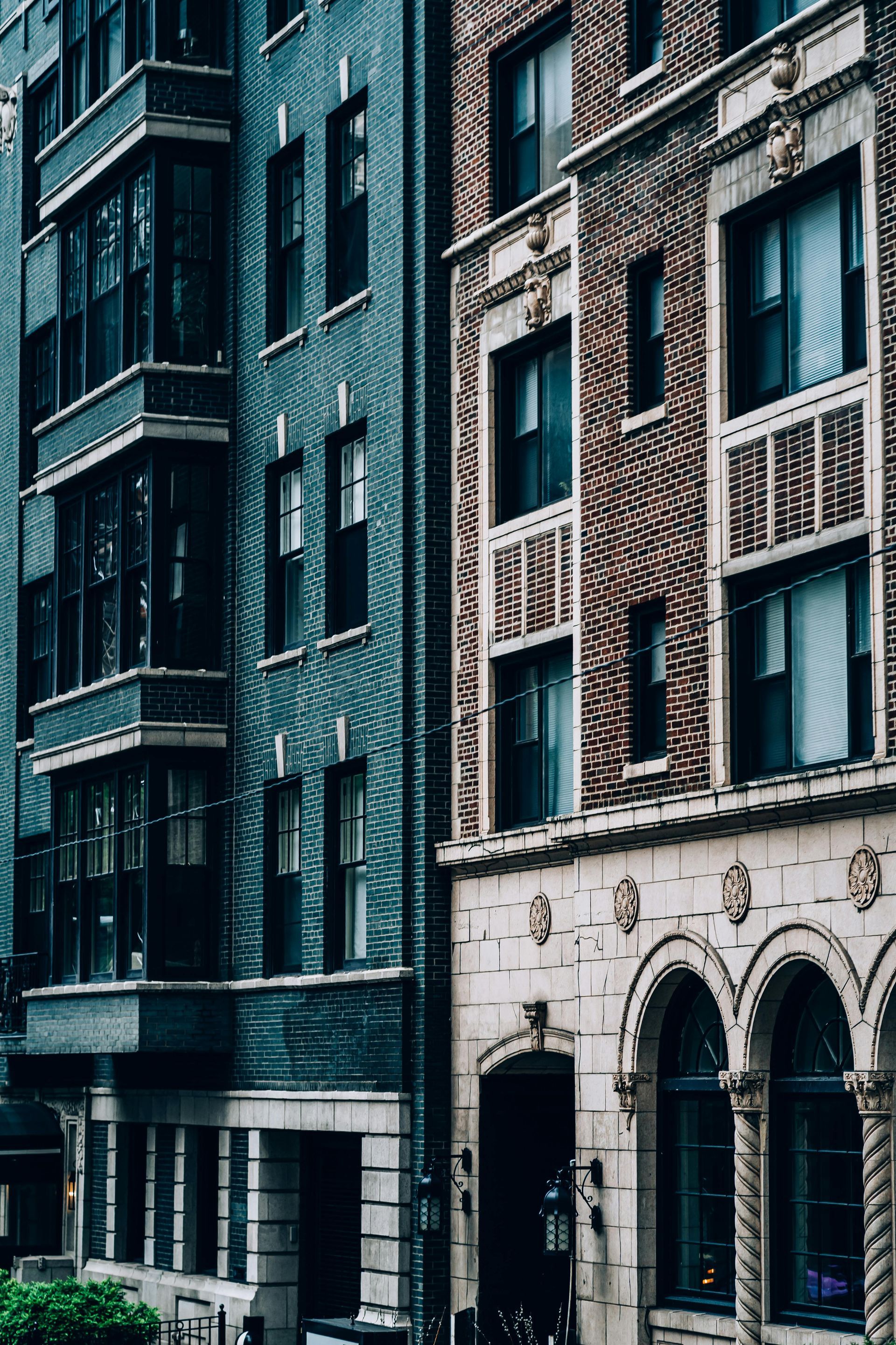 Buildings with teal and brick facades.