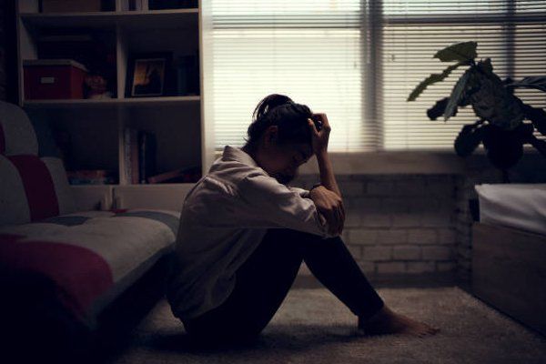 Depressed Woman In A Dark Room — North Salt Lake, UT — Lifeline for Youth