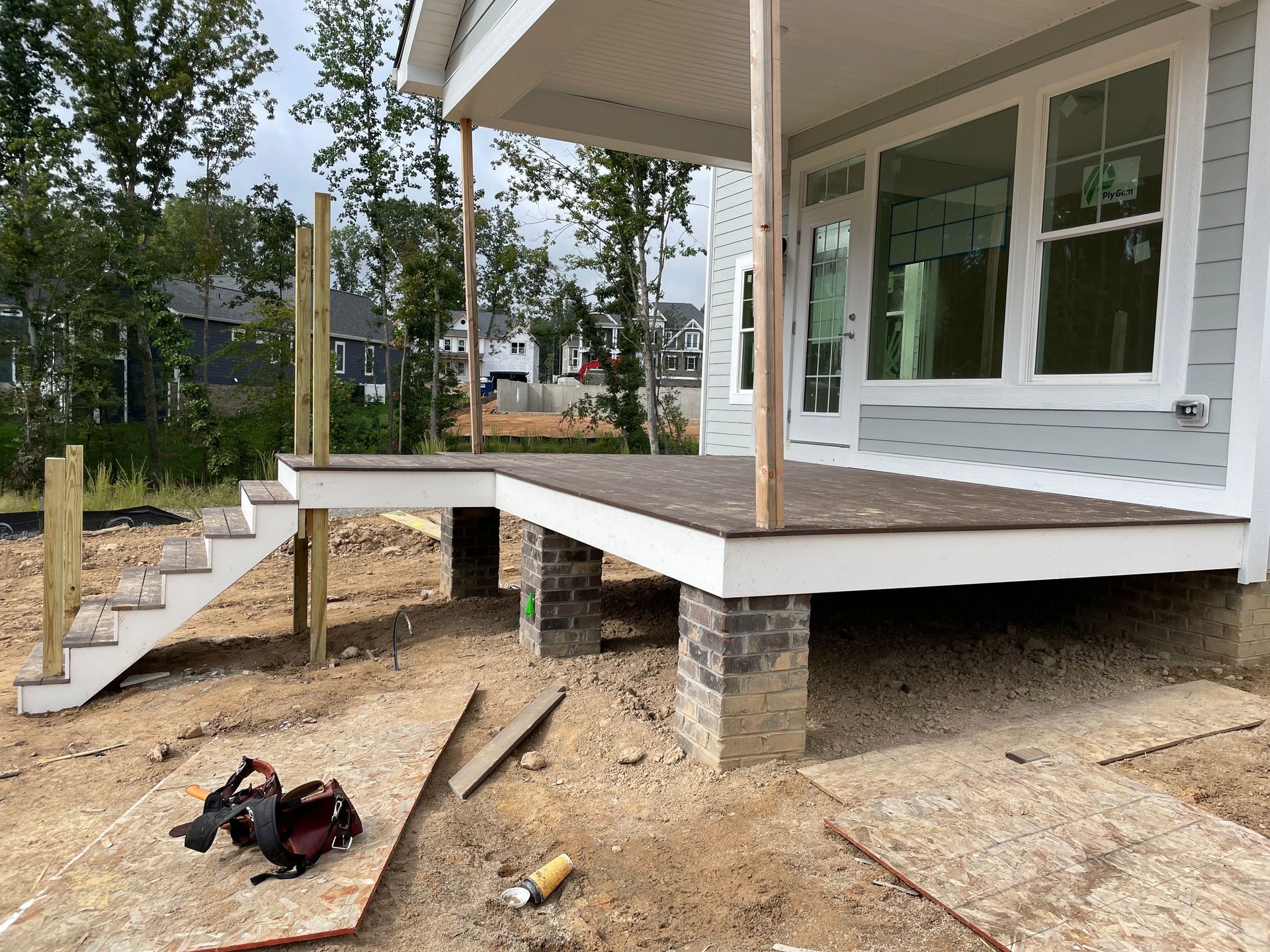 A deck is being built on the side of a house