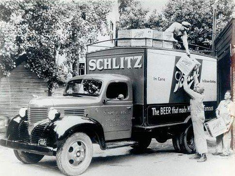 A black and white photo of a truck with the word schlitz on it.