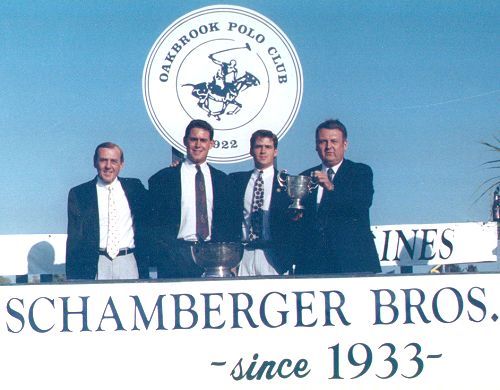 A group of men standing in front of a sign that says schamberger bros since 1933
