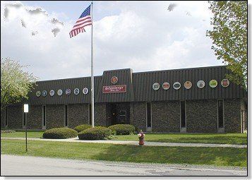 An american flag is flying in front of a building