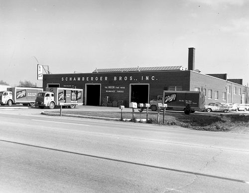 A black and white photo of a schwander bros. inc. building