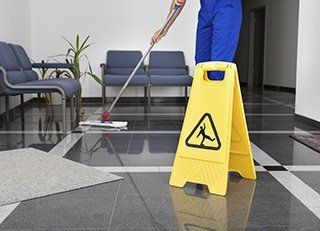 janitor cleaning a hospital floor
