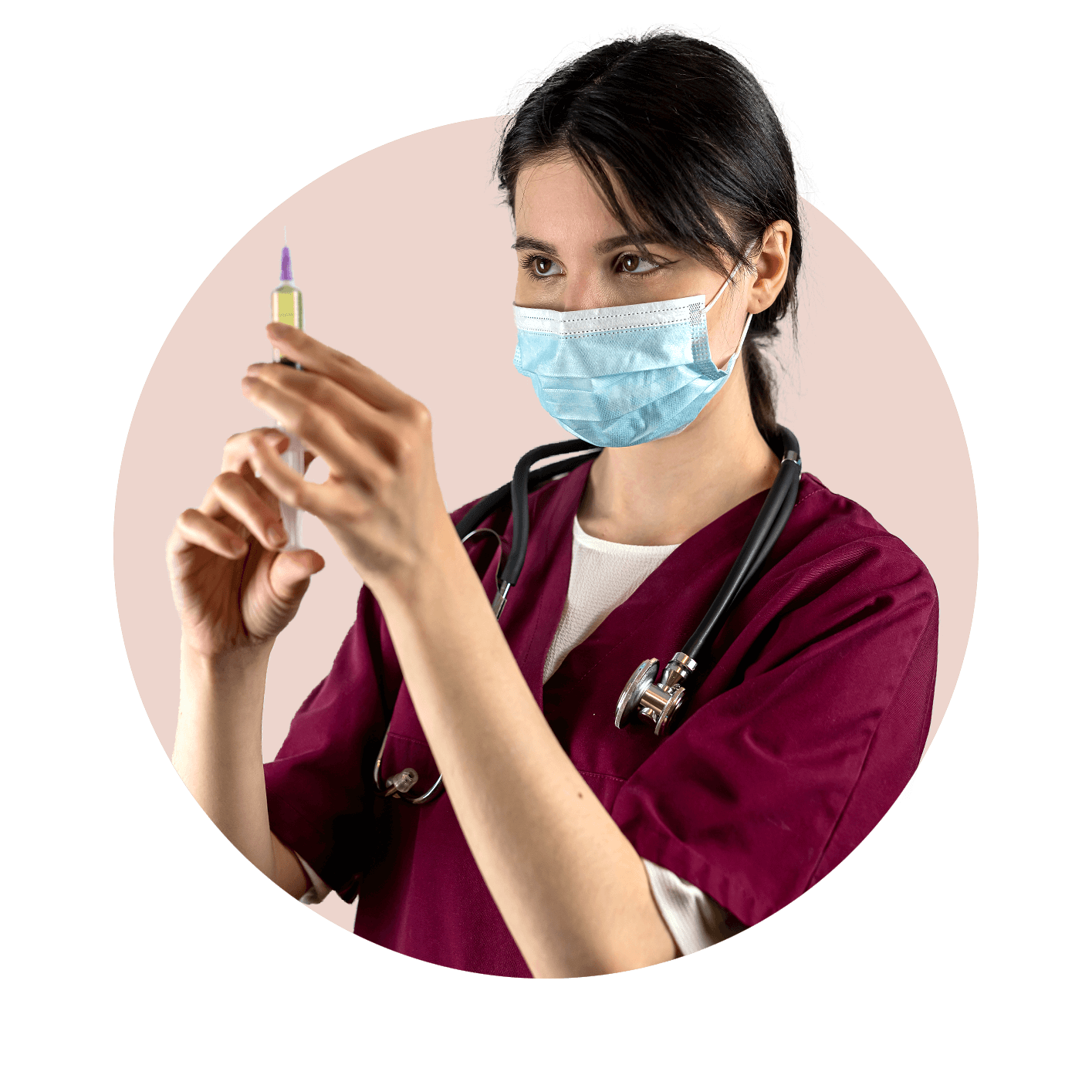 Nurse in burgundy scrubs with mask on and holding vaccine